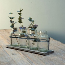 Wooden rack with mini jars by Grand Illisions